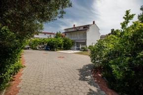 Family friendly apartments with a swimming pool Palit, Rab - 4990